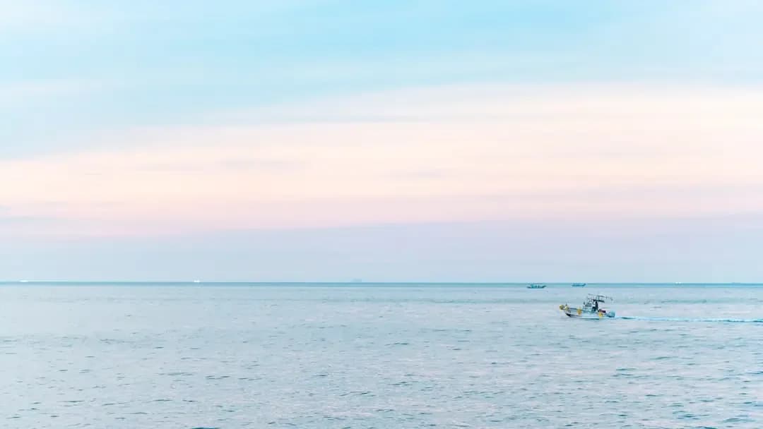 person riding powerboat in ocean