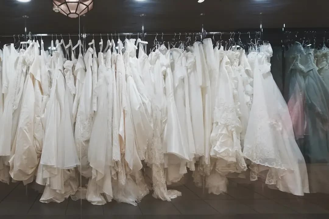 A rack of wedding gowns in a store
